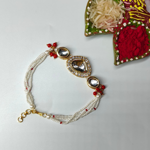 Red Gold Plated Kundan Studded & Beaded Rakhi & Bracelet