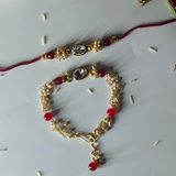 Gold Plated Diamond Stone Studded & Pearl Couple Rakhi