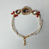 Red Gold Plated Kundan Studded & Beaded Rakhi & Bracelet